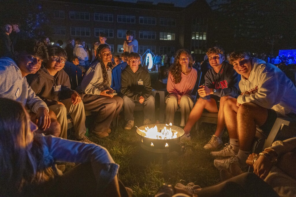 The Class of 2029 Move-in Weekend gather around fire pits and glow swings on Founders Green on Aug. 21, 2025