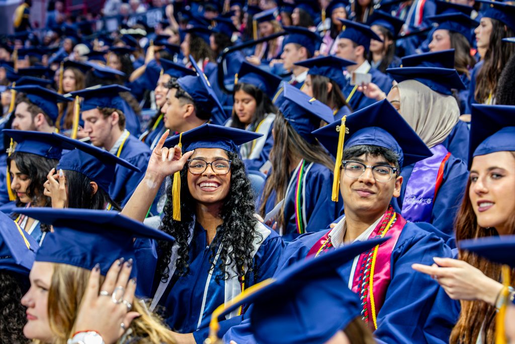 Students walk in a procession for the 2026 College of Agriculture, Health and Natural Resources (CAHNR) Commencement, heading down Hillside Rd. into Harry A. Gampel Pavilion (GAMP). May 9, 2026. 